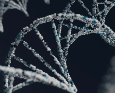 Estrutura de DNA em close com moléculas formando dupla hélice em fundo escuro